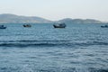 Local fishing boats on sea. Vintage colourful boats with fishing nets