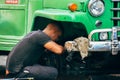 A local fixing his truck in Havana city, Cuba.