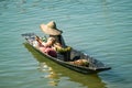 Local flower trader on a small boat on Inle Lake, Myanmar. Royalty Free Stock Photo