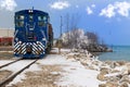 A local freight train moving along a frozen landscape