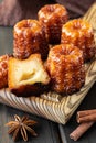 Local French dessert canele on a wooden board