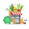 Local fruit and vegetables store building. Groceries crates in front of storefront.