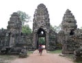 Local girl ride a bicycle into temple in Siem reap, cambodia