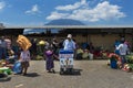 Local girl wearing traditional clothing buying ice cream in a street market in the city of Antigua, in Guatemala, Central America