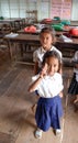 Local Girls in Rural Schoolhouse on Tonle Sap Lake, Cambodia Royalty Free Stock Photo