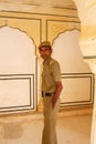 Local guard standing in Sattais Katcheri Hall, Amber Fort, Jaipur, India