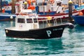 The local harbor pilot boat returning to its berth in the ferry terminal marina at Los Cristianos on the island of Teneriffe in th