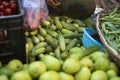 Local Indian vendor assorting fresh tomatoes in a plastic bag during lock down period in India.