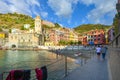 Local Italian children play soccer on the sandy beach in the harbor of Vernazza, Italy, part of the Cinque Terre.