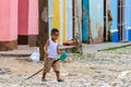 Local kid playing on the street in Trinidad, Cuba Royalty Free Stock Photo