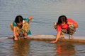 Local kids drinking from water reservoir, Khichan village, India