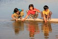 Local kids drinking from water reservoir, Khichan village, India