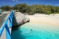 Local kids jumping off the Mouli Bridge between Ouvea and Mouli islands, Loyalty Islands, New Caledonia