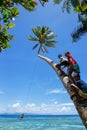 Local kids swinging on a rope swing in Lavena village, Taveuni I