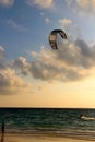 Local kitesurfer get the last kite in for the day
