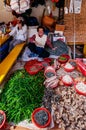 Local Korean woman selling fresh chili peppers in Jagalchi market, Busan