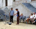 Local lady showing the tourists how to make cotttage cheese