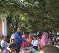 A local level political leader distributing prizes to laborious students of a school