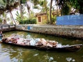 Local life of Alleppey Kerala India a man in wooden boat purchasing trash