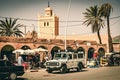 Local life in Foum Zguid. Old town on the edge of the Sahara desert. Local shops in old houses with a classic land rover defender Royalty Free Stock Photo