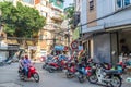 Local daily life of the street in Hanoi, Vietnam. People can seen having their food beside the street. Royalty Free Stock Photo