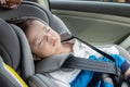 Local lifestyle Asian Chinese baby boy on child safety car seat Royalty Free Stock Photo