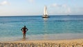 Local looks at boat on caribbean Royalty Free Stock Photo