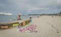 A local malagasy man is selling corals on the beach