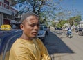 A local malagasy muslim taxi driver is looking on the camera