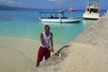 Local man cutting fish in Doctor's Cove Beach in Jamaica, Caribbean Royalty Free Stock Photo