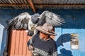 Local man with an eagle in the Colca Canyon, Peru