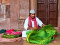 Local man folding cloth inside Jama Masjid in Fatehpur Sikri, Ut