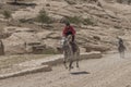 Local man, jordanian rides a horse. The road to Petra, to Al Khazneh, the Treasury. Petra, an archaeological city in Jordan