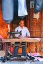 Local man making motorbike seat covers at Johari Bazaar street i