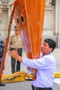 Local man playing harp during Festival of the Virgin de la Candelaria in Lima, Peru