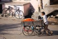 Local man pushing cart with tomatoes in Jaipur, Rajasthan, India