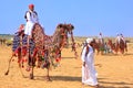 Local man riding a camel at Desert Festival, Jaisalmer, India