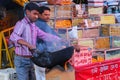 Local man roasting peanuts at Johari Bazaar in Jaipur, India.