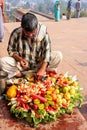 Local man selling food outside Buland Darwasa Victory Gate lea