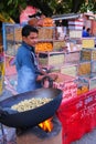 Local man selling snacks at Johari Bazaar in Jaipur, India