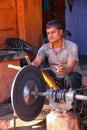 Local man sharpening tool at Johari Bazaar street in Jaipur, Rajasthan, India