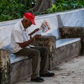 Man reading the Granma