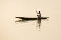 Local man in small boat for transportation in the lake of Srinagar, Jammu and Kashmir state, India Royalty Free Stock Photo