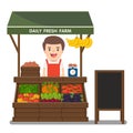 Local market farmer selling vegetables produce. Royalty Free Stock Photo