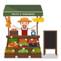 Local market farmer selling vegetables produce. Royalty Free Stock Photo