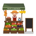 Local market farmer selling vegetables produce. Royalty Free Stock Photo