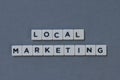 ' Local Marketing ' word made of square letter word on grey background