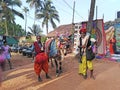 Indian men dressed local syle with a cow. Wednesday Anjuna Flea Market. India, Goa