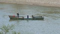 Local Men Extract Sand out of River into Flatboat
