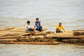 Local men floating on a bamboo raft down Ayeyarwady river near M Royalty Free Stock Photo